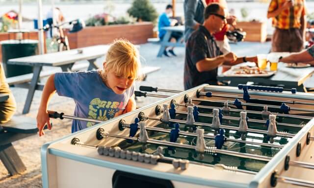 young person playing Fussball