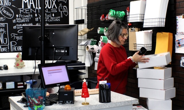 Person at register in store